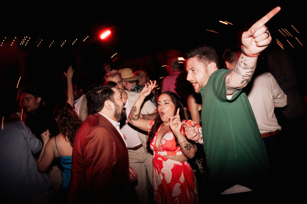 Guests dancing at night wedding reception at Las Caletas Puerto Vallarta, candid documentary style