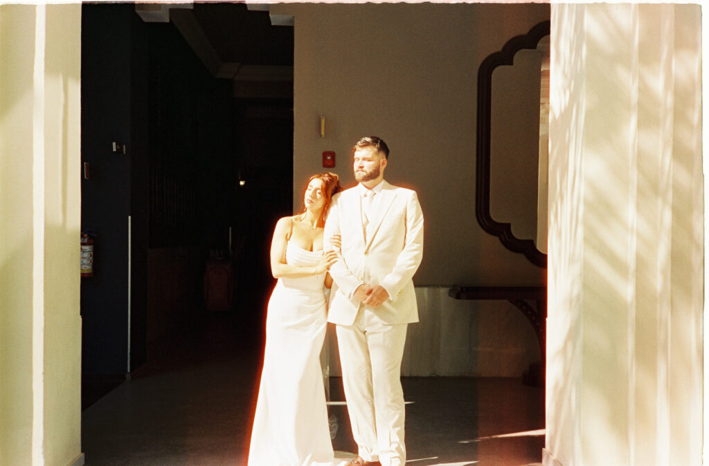 Bride and groom in white at Riu Vallarta wedding, film photography by Alex Obregón, Puerto Vallarta