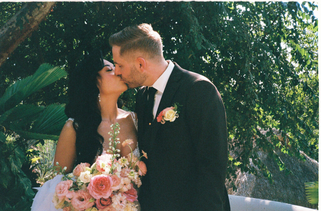 Bride and groom first kiss at Villa Valentin Sayulita wedding, shot on 35mm film by documentary photographer