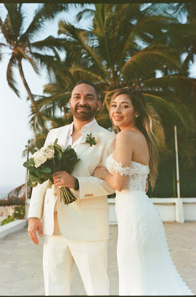 Bride and groom portrait on rooftop terrace, Puerto Vallarta wedding, 35mm film photography