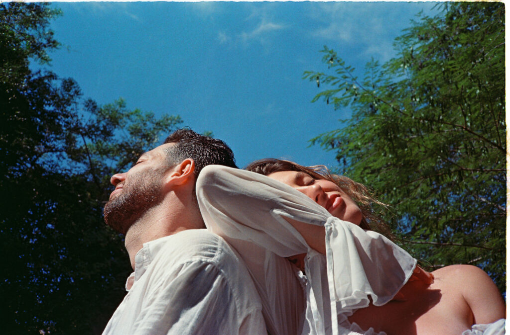 Couple embracing outdoors in Puerto Vallarta, shot on 35mm film by engagement photographer Alex Obregón