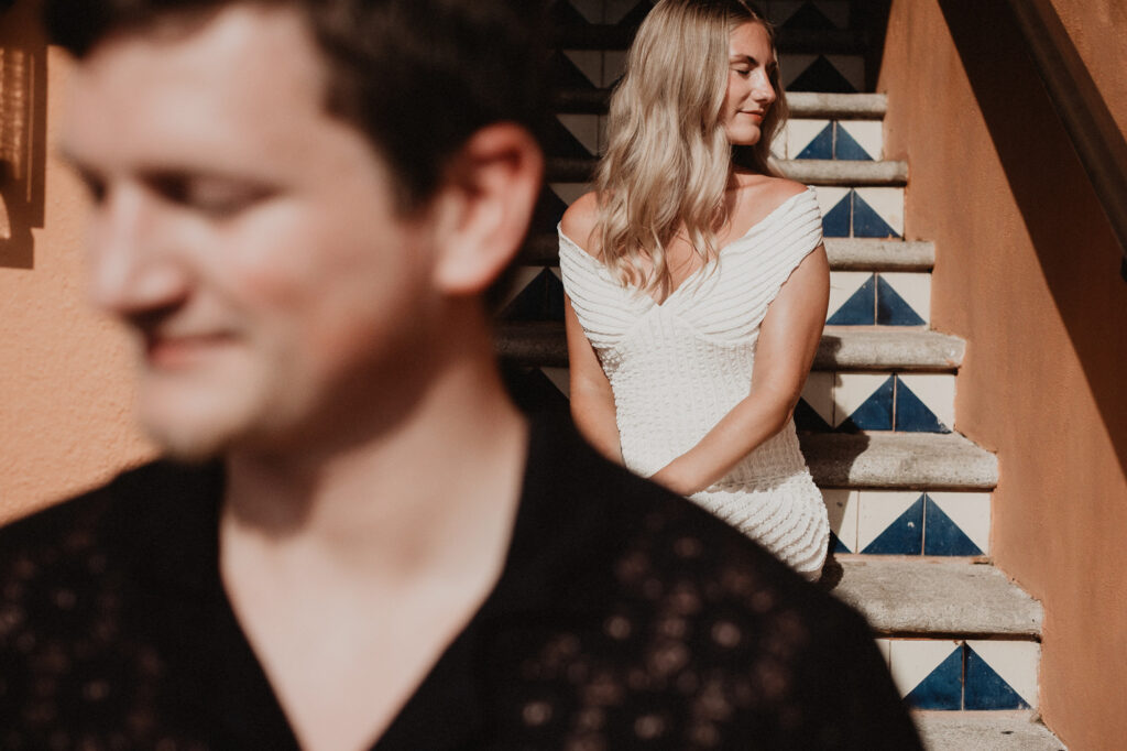 Couple at tiled staircase, Casa Cosmos Puerto Vallarta engagement session by pre wedding photographer Alex Obregón