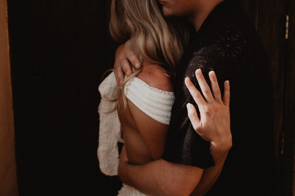 Couple embracing at Casa Cosmos Puerto Vallarta engagement session, warm moody light by destination wedding photographer