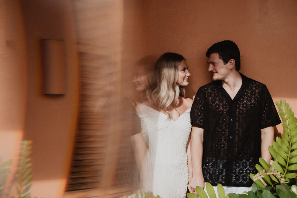 Couple holding hands at Casa Cosmos Puerto Vallarta engagement session by pre wedding photographer Alex Obregón