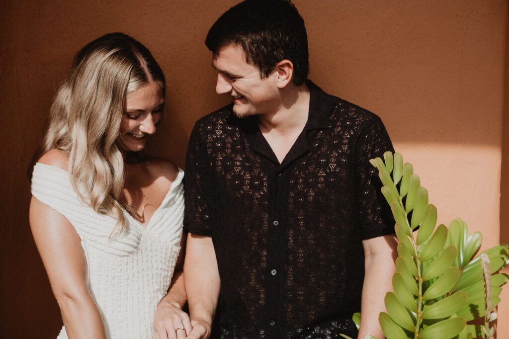 Couple sharing a joyful moment during engagement session at Casa Cosmos Puerto Vallarta