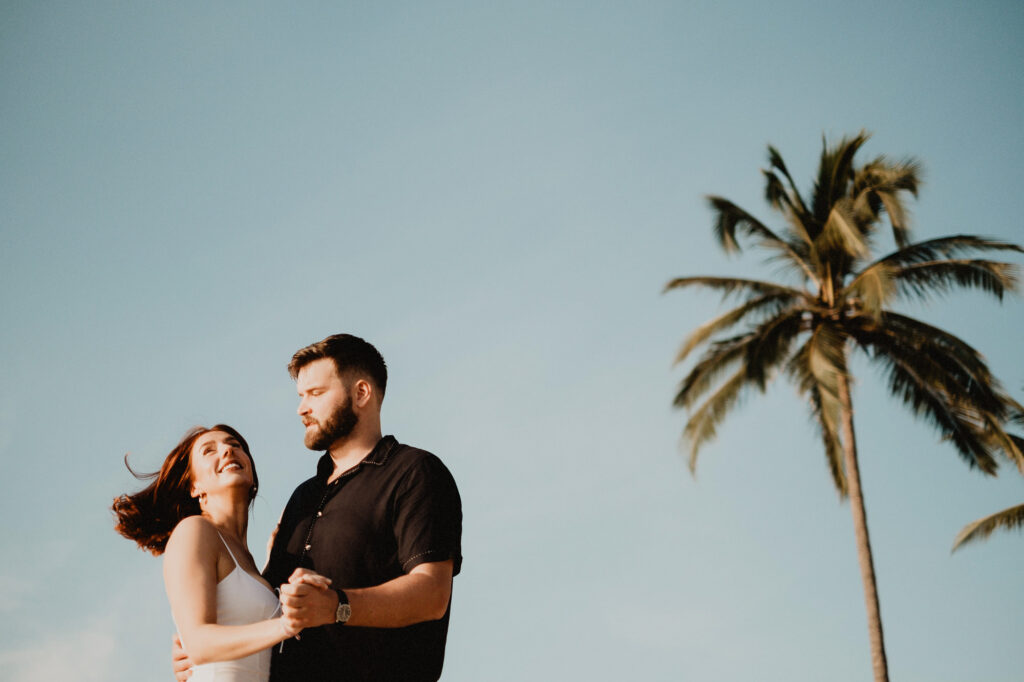 Couple dancing at golden hour on the beach in Puerto Vallarta engagement session by Alex Obregón