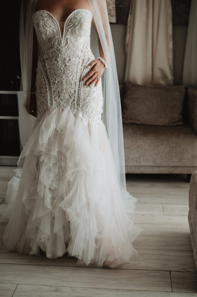 Bride in lace mermaid gown with tulle skirt and veil, wedding day getting ready, Hilton Puerto Vallarta
