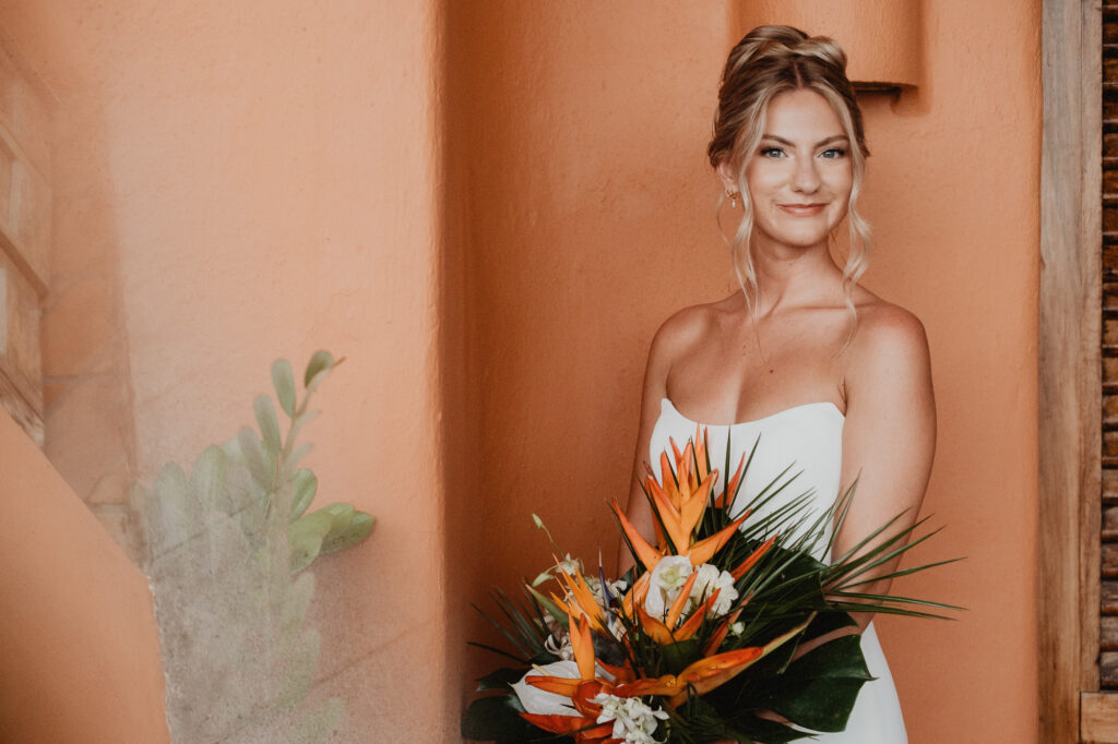 Bride holding bird of paradise bouquet at Casa Cosmos, Puerto Vallarta wedding ceremony