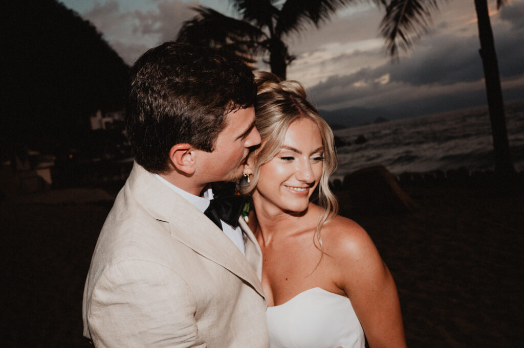 Bride and groom share a tender moment at sunset on the beach at Casa Cosmos, Puerto Vallarta wedding