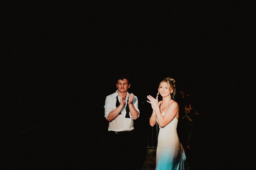 Bride and groom clapping at night wedding reception, Casa Cosmos Puerto Vallarta