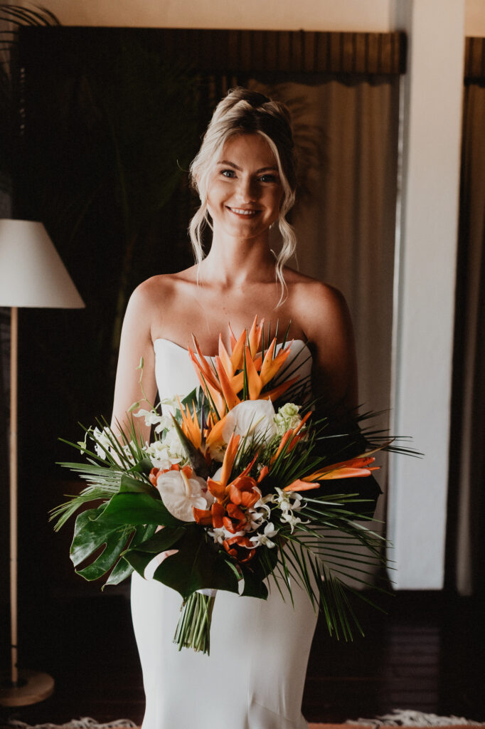 Bride holding tropical bouquet with birds of paradise at Casa Cosmos, Puerto Vallarta wedding
