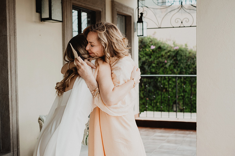 Bride and mother embrace with tears during wedding day in San Miguel de Allende, documentary photography