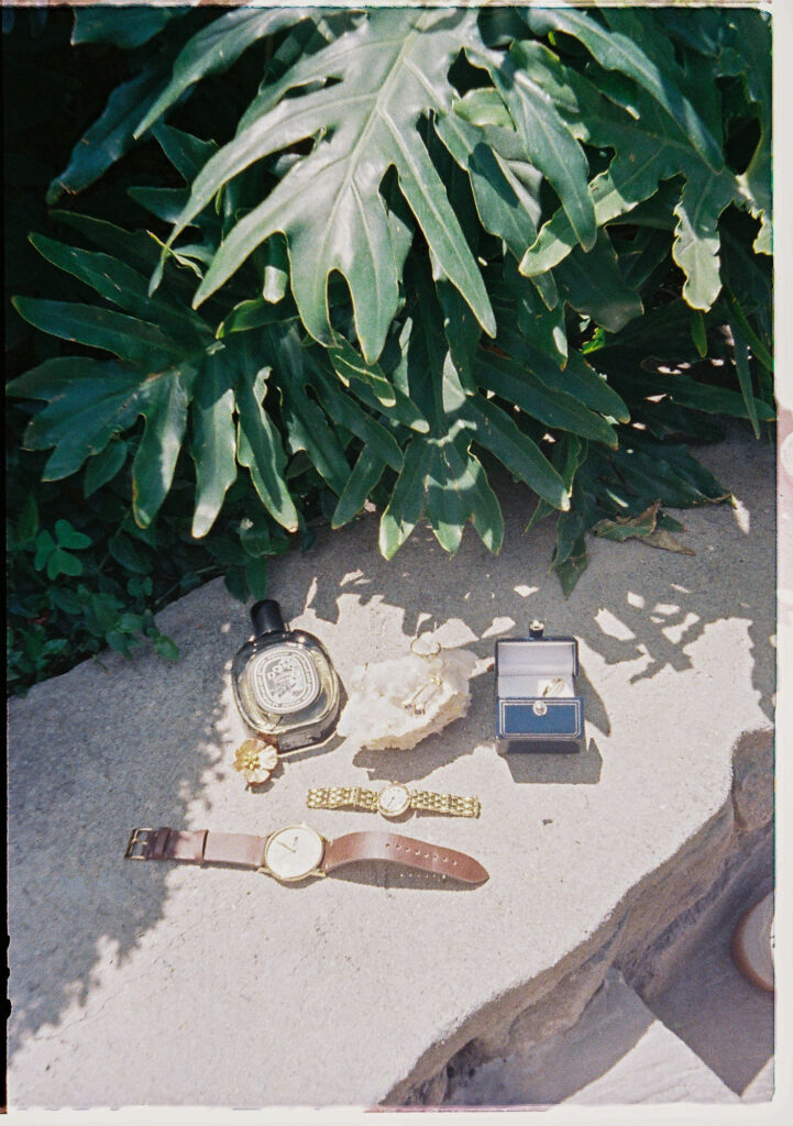 Wedding details on stone surface in San Miguel de Allende, film photography, perfume, watches, ring box