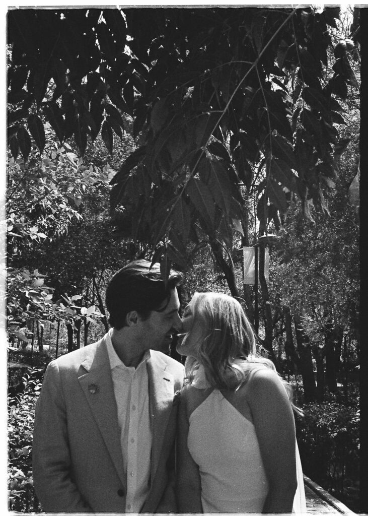 Couple sharing a tender kiss during wedding ceremony in San Miguel de Allende, shot on 35mm film