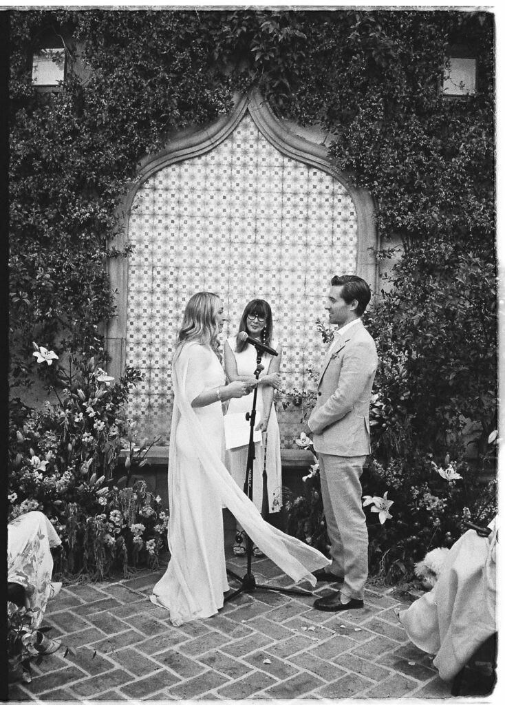 Wedding ceremony at an ivy-covered arch in San Miguel de Allende, captured on 35mm film