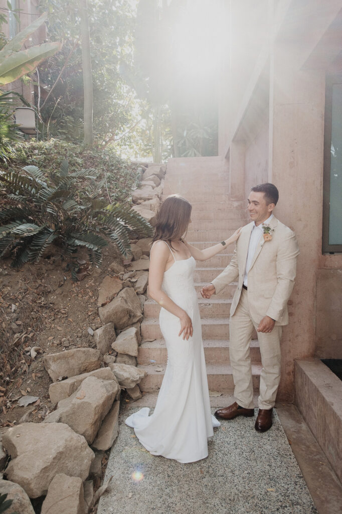 Bride and groom share a first look on stone steps at Rosa Morada, San Pancho elopement