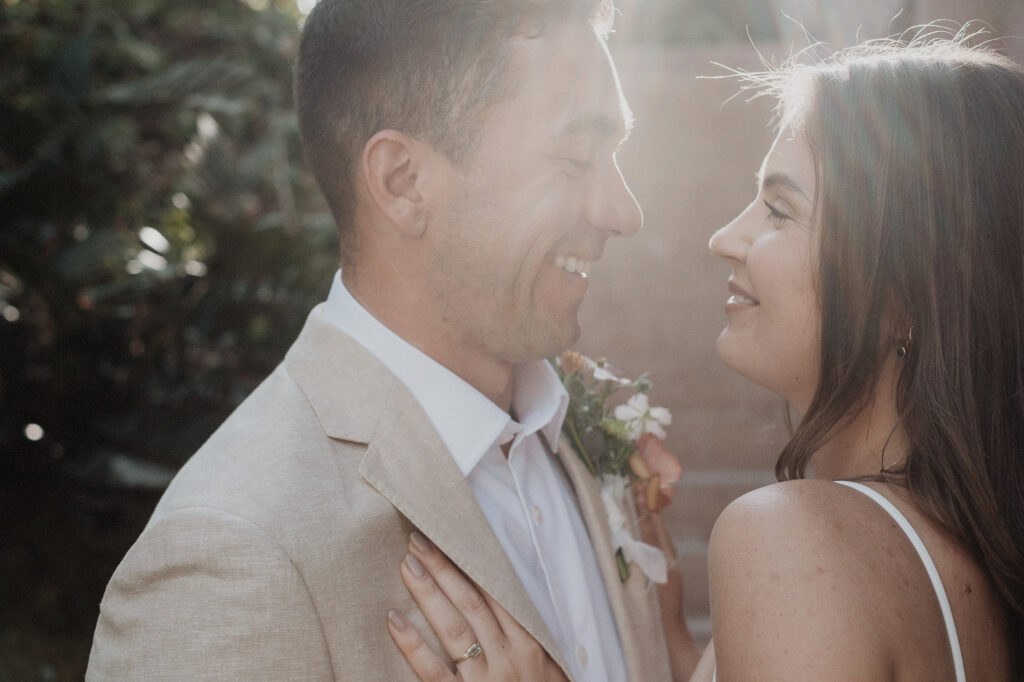 Bride and groom laughing together during elopement at Rosa Morada, San Pancho, Mexico