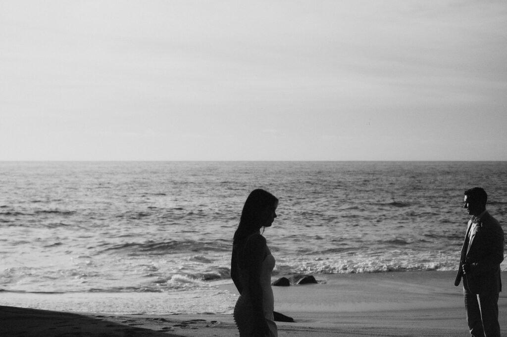 Elopement couple silhouetted on beach at sunset, San Pancho Mexico, documentary wedding photography
