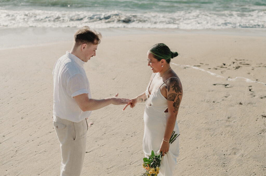 Couple exchanging rings during beach elopement at Villa Amor Sayulita Mexico