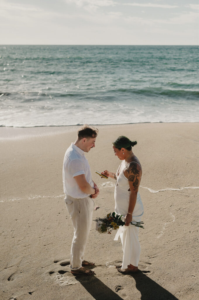 Couple exchanging vows barefoot on the beach during a Sayulita elopement at Villa Amor, Mexico