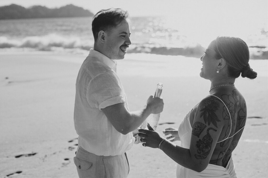 Couple laughing together on beach during elopement at Villa Amor Sayulita Mexico