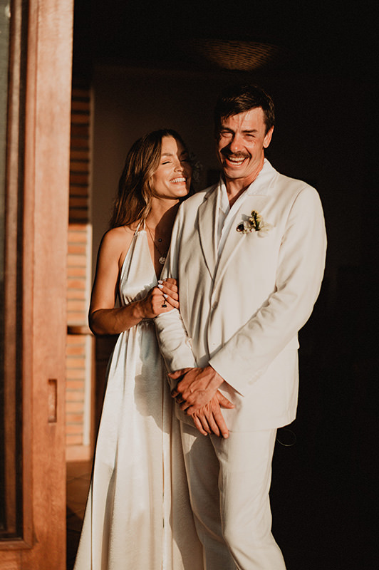 Bride and groom laughing together at Villa del Sol, Sayulita wedding ceremony, documentary film photography