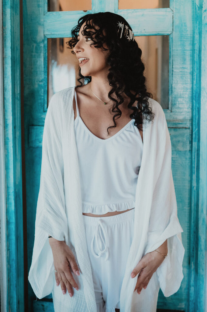 Bride getting ready in white robe and star hair clip, Frente al Punto, Sayulita wedding