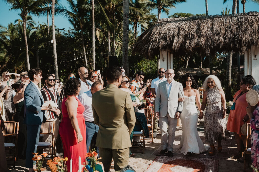 Bride walks down the aisle with family at outdoor wedding ceremony, Frente al Punto, Sayulita