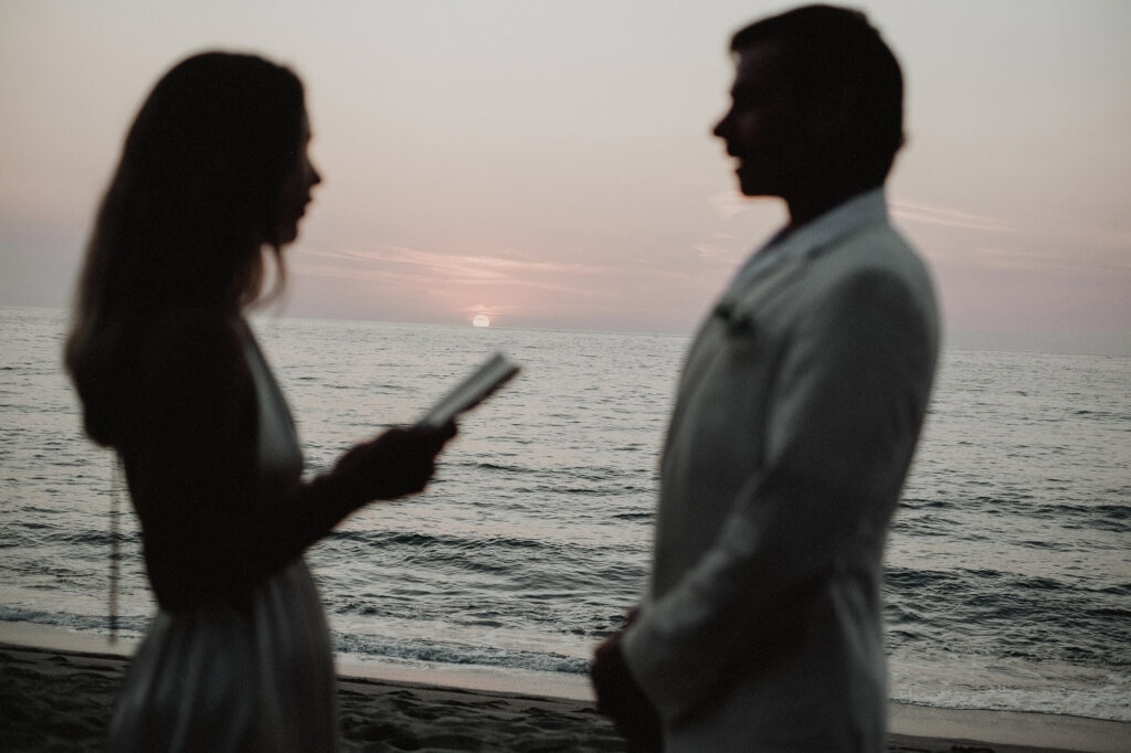 Couple exchanging vows at sunset on the beach in Sayulita, wedding ceremony at Villa del Sol