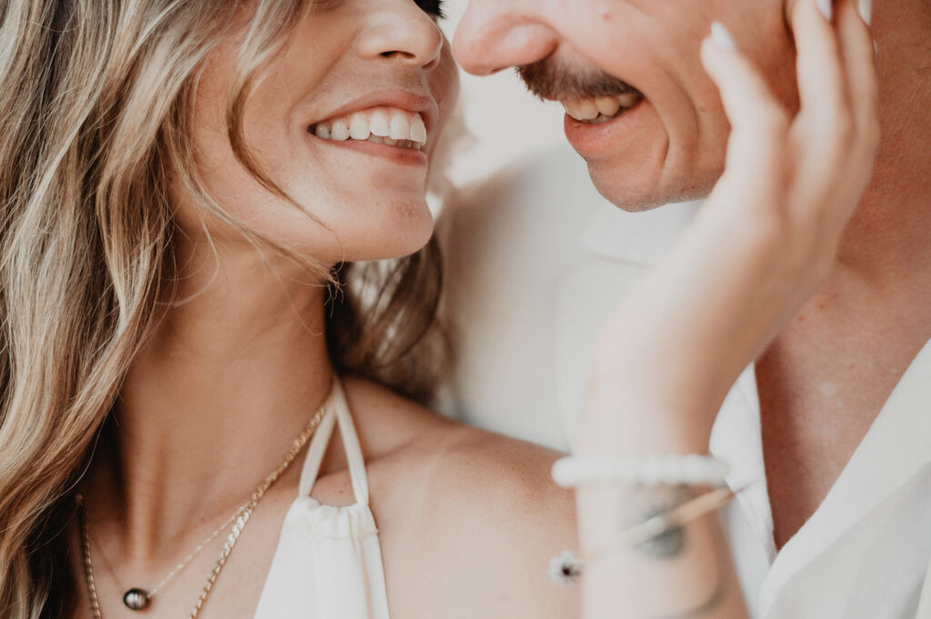 Couple laughing and almost kissing at Villa del Sol, Sayulita wedding, documentary style