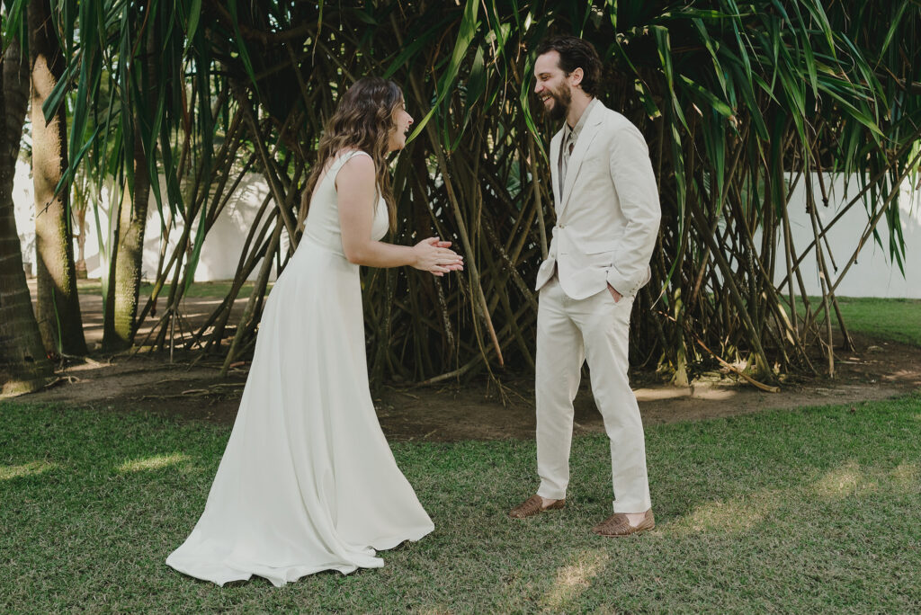 Bride and groom laughing together during wedding first look at Frente al Punto, Sayulita
