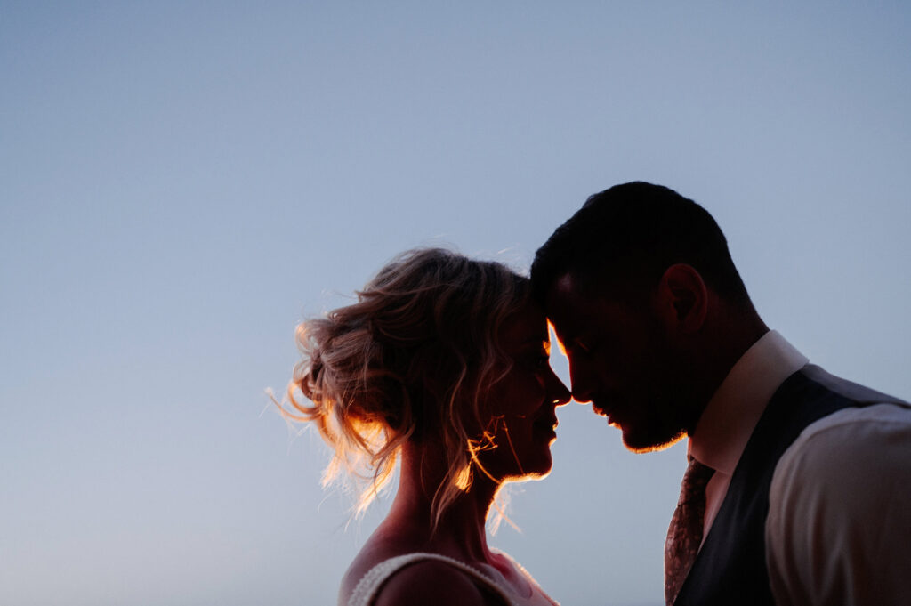 Bride and groom silhouette at golden hour, Villa Amor Sayulita wedding ceremony, documentary photography