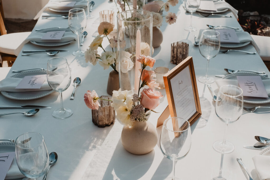 Wedding reception table setting at Villa Valentin Sayulita with blush florals, candlelight, and place cards