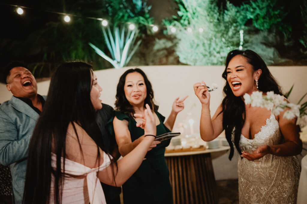 Bride laughing with guests at Villa Valentin wedding reception in Sayulita, Mexico