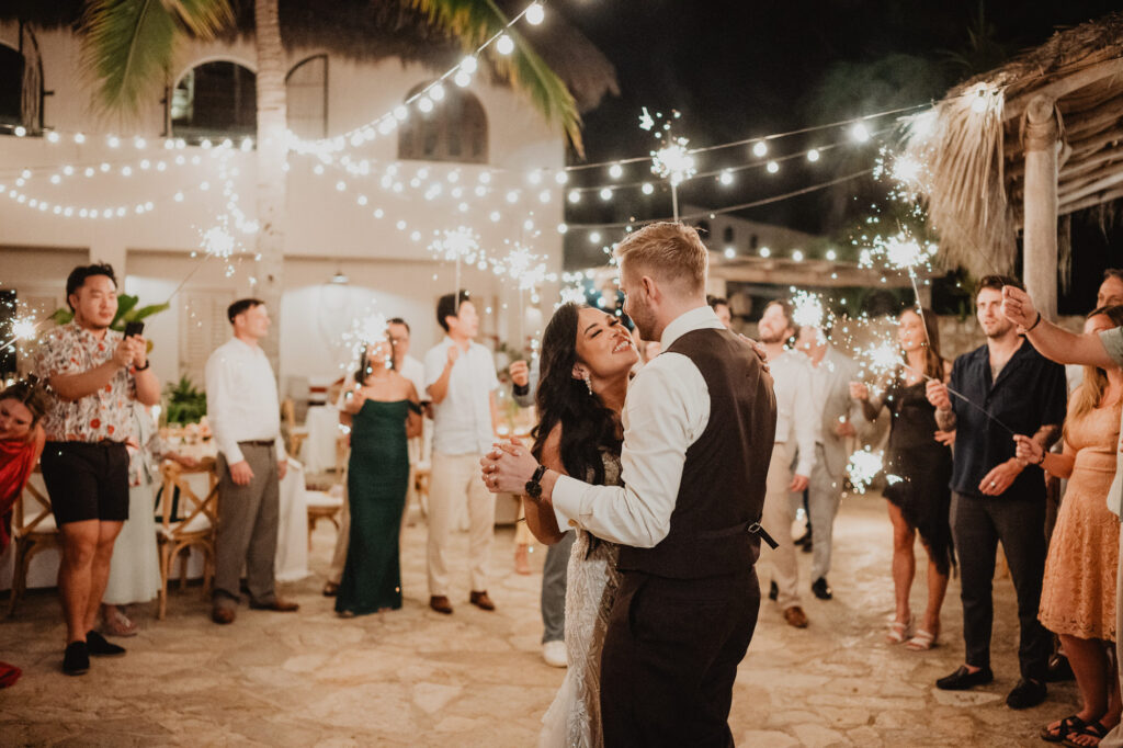 Bride and groom first dance surrounded by sparklers at Villa Valentin Sayulita wedding reception