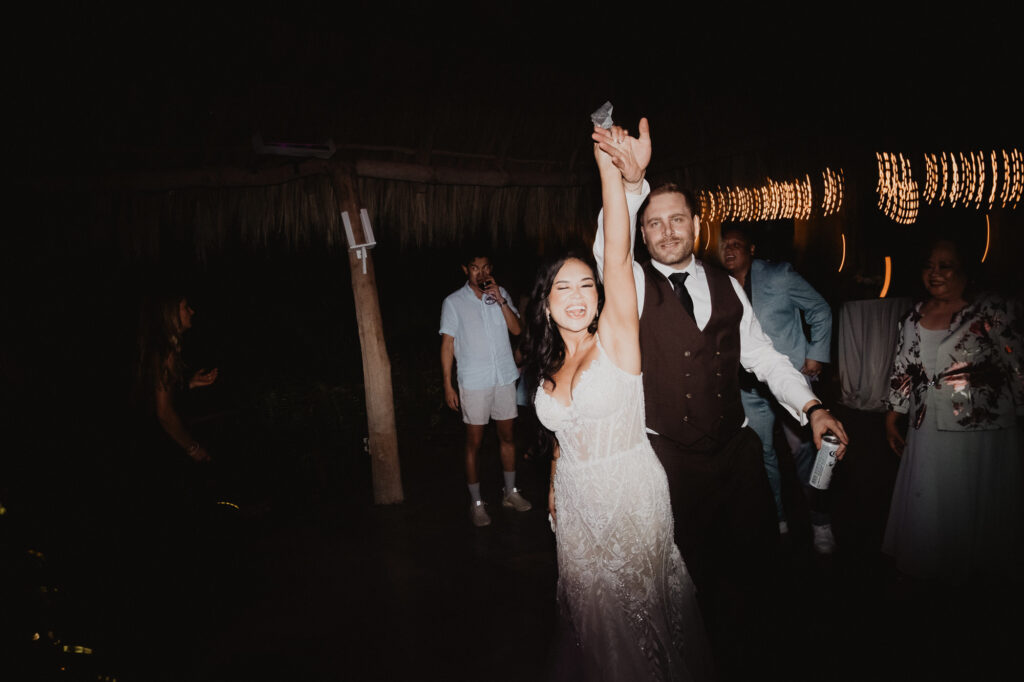 Bride and groom dancing joyfully at wedding reception, Villa Valentin, Sayulita, Mexico