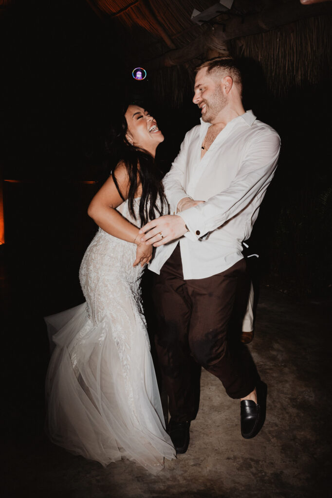 Bride and groom laughing and dancing at wedding reception, Villa Valentin Sayulita Mexico