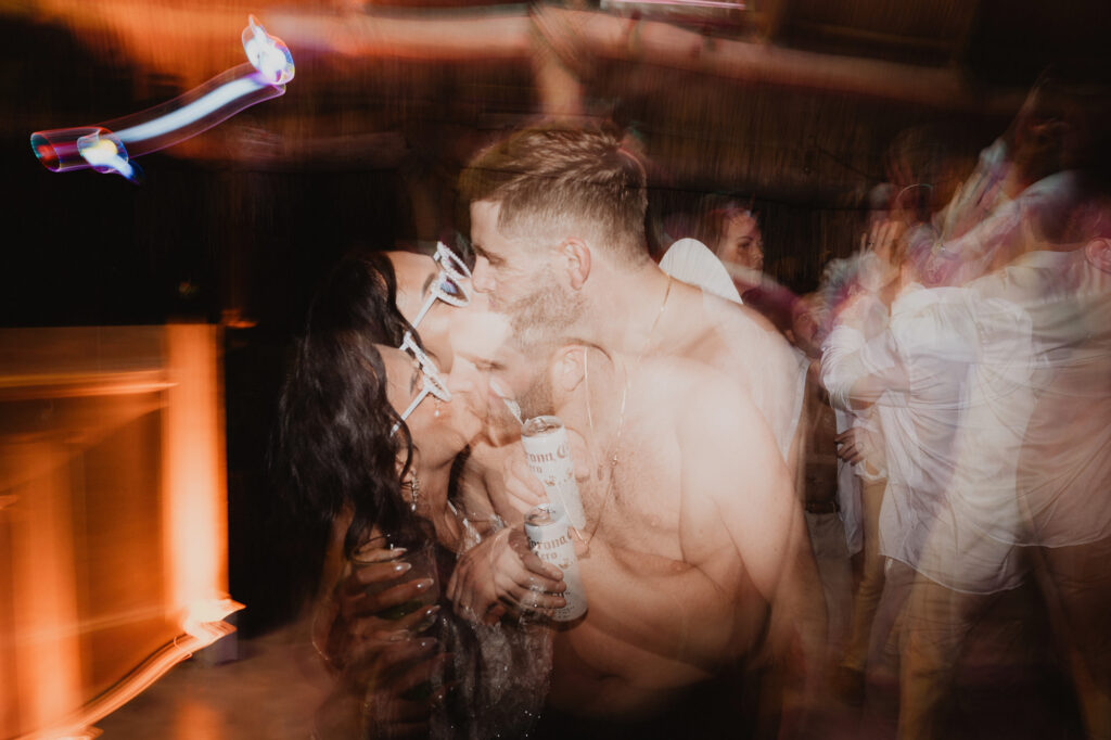 Couple kissing on the dance floor at a wedding reception at Villa Valentin Sayulita, Mexico