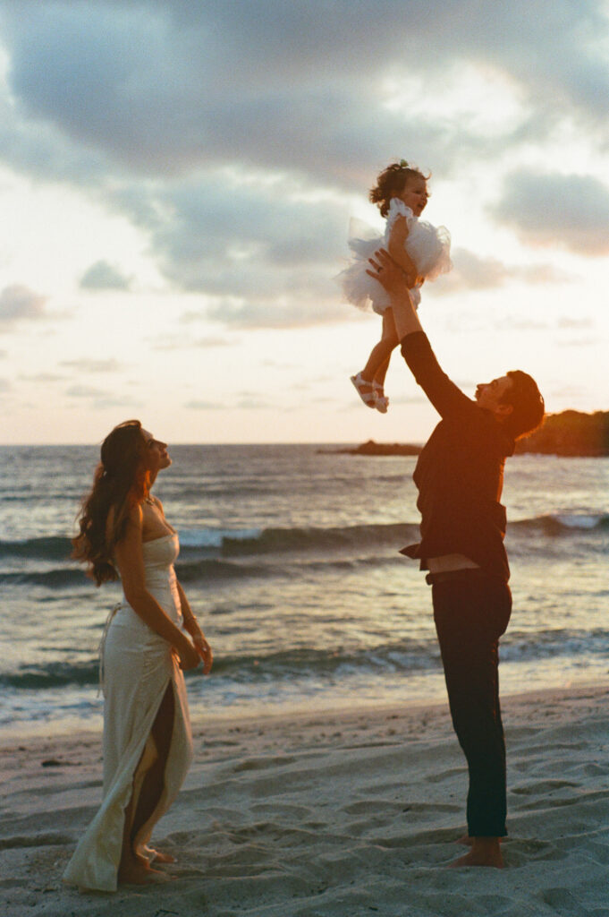Father lifts toddler at sunset beach elopement, St Regis Punta Mita, analog film photography