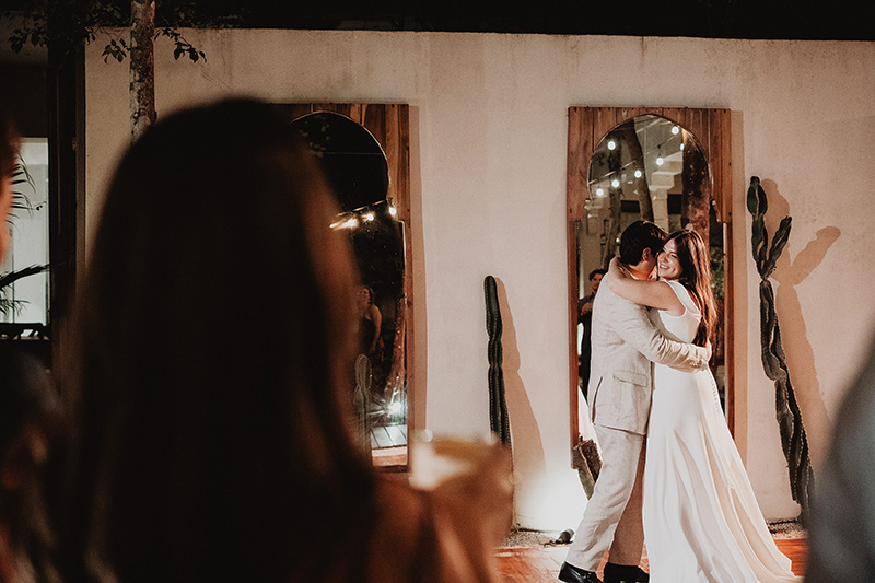 Bride and groom share first dance at Ambre & Epieces Tulum wedding reception, documentary style